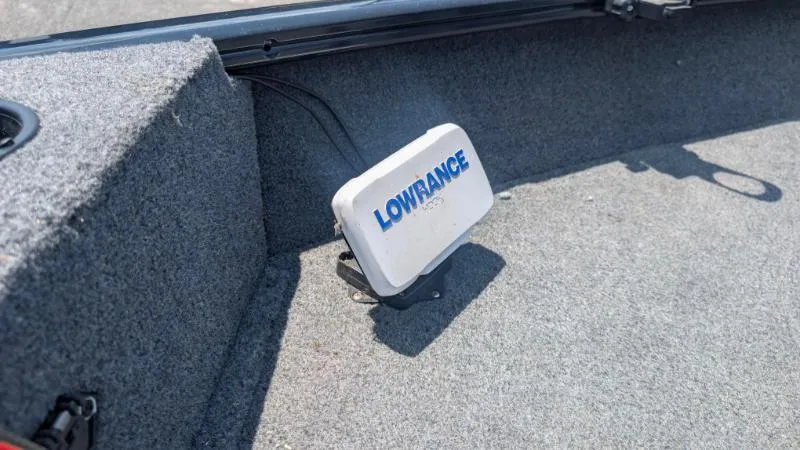 Slide: The Image of Lowrance device installed on 2022 Tracker Pro Guide V 16 SC boat carpeted floor. - 6