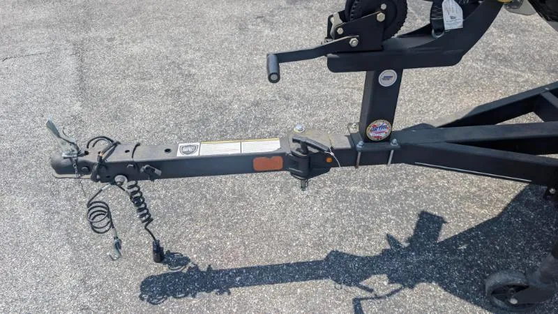 Slide: The Image of Trailer hitch of 2022 Tracker Pro Guide V 16 SC on asphalt surface. - 8