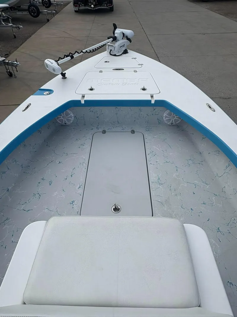 Slide: The Image of 2022 Mamba 24VX boat interior with trolling motor and spacious seating. - 17