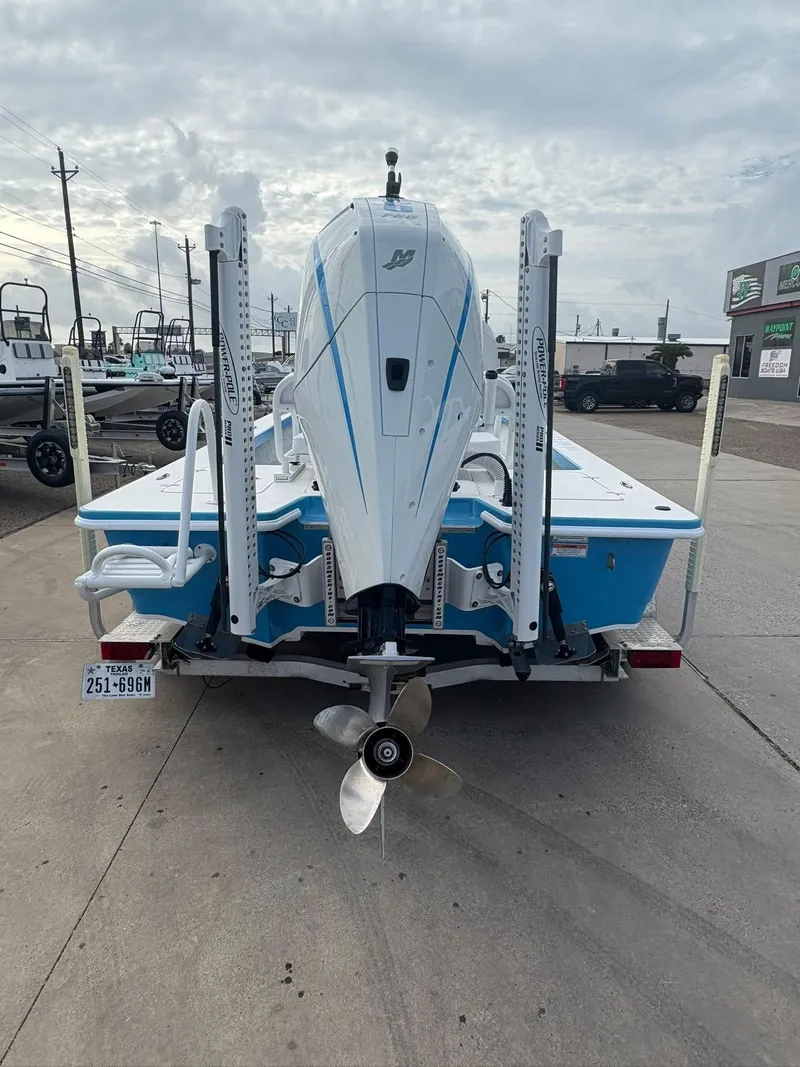 Slide: The Image of Rear view of a 2022 Mamba 24VX boat on a trailer, showcasing its motor and propeller. - 3