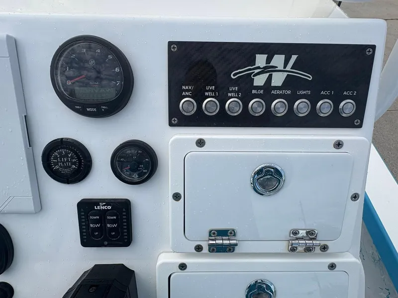 Slide: The Image of Control panel of 2022 Mamba 24VX boat with gauges and switches. - 4