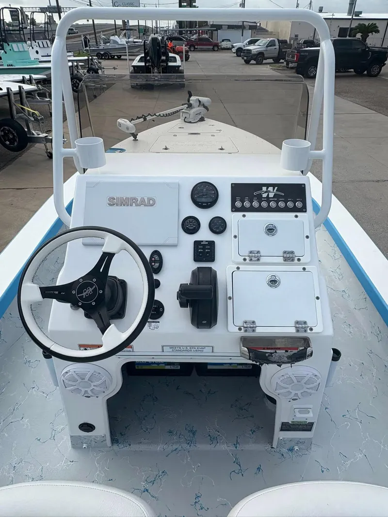Slide: The Image of 2022 Mamba 24VX boat dashboard with steering wheel and control panel. - 5