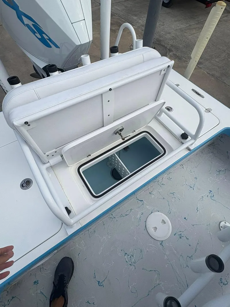Slide: The Image of Open storage compartment on 2022 Mamba 24VX boat, showcasing interior design and functionality. - 7
