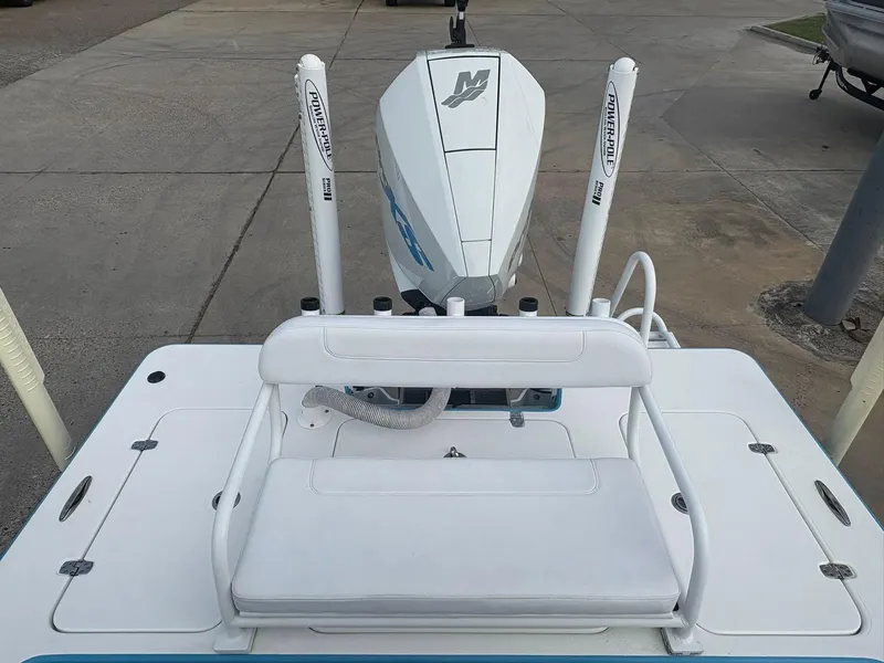 Slide: The Image of 2022 Mamba 24VX boat with Power-Pole anchors and white seating. - 8