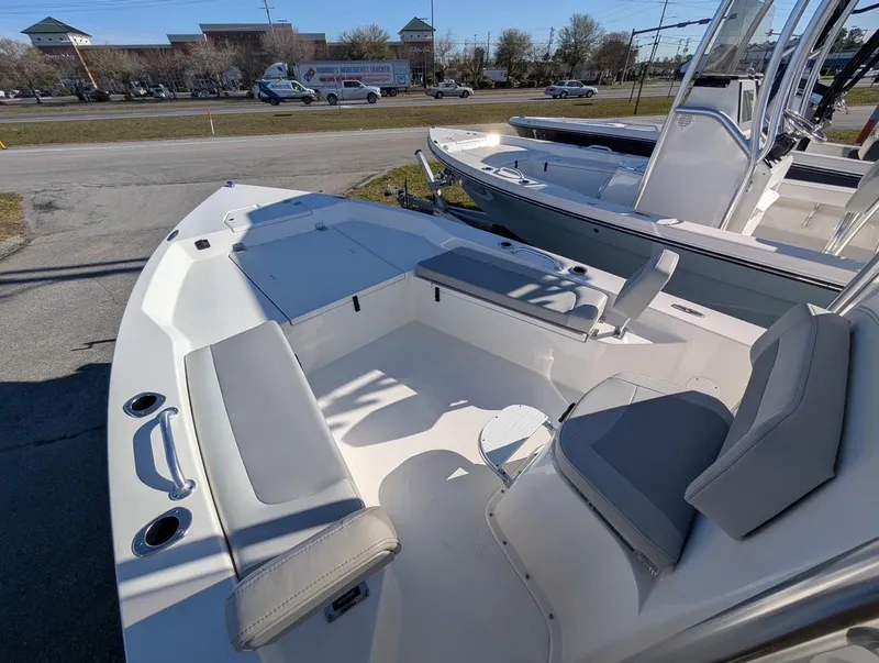 Slide: The Image of 2025 Bay Rider 239 Bay boat interior with seating and storage compartments. - 4