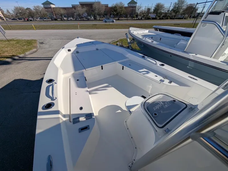 Slide: The Image of 2025 Bay Rider 239 Bay boat interior with seating and storage compartments. - 5
