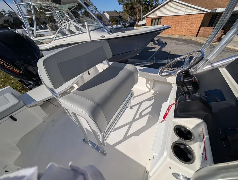 Slide: The Image of 2025 Bay Rider 239 Bay boat interior with steering console and seating. - 12
