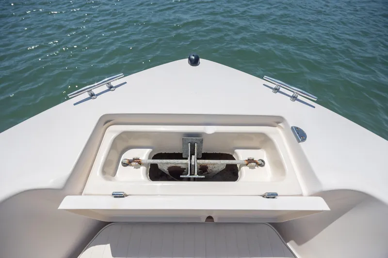 Slide: The Image of Bow of 2010 Grady-White Sportsman 180 boat with anchor compartment open. - 13