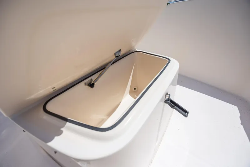 Slide: The Image of Open storage compartment on a 2010 Grady-White Sportsman 180 boat. - 14