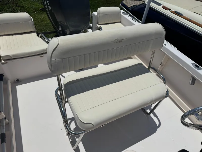 Slide: The Image of 2010 Grady-White 180 Sportsman boat interior with white cushioned seating. - 4