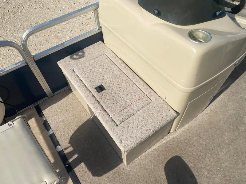 Slide: The Image of 2014 Lowe SF194 Sport Fish boat interior with beige seating and storage compartment. - 11