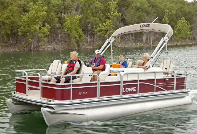Slide: The Image of Manufacturer Provided Image: 2014 Lowe SF194 Sport Fish pontoon boat on a lake with passengers. - 13