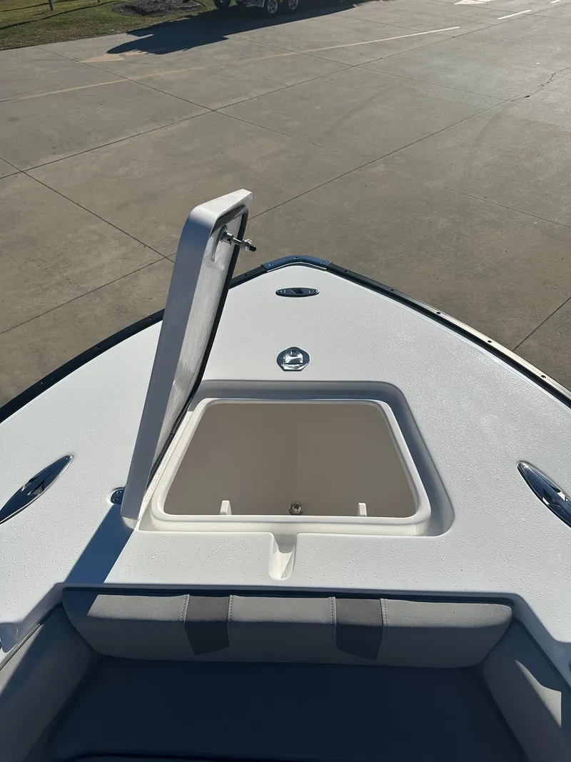 Slide: The Image of 2025 Cape Horn 28XS boat with open storage compartment on deck. - 19