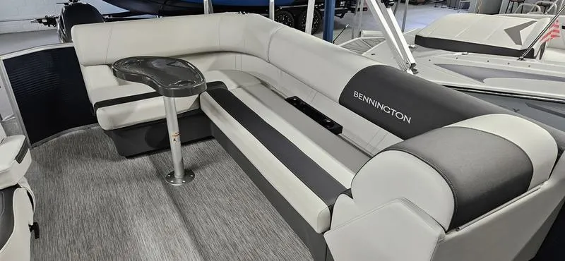 Slide: The Image of 2026 Bennington 20 SL boat interior with plush seating and sleek design. - 12