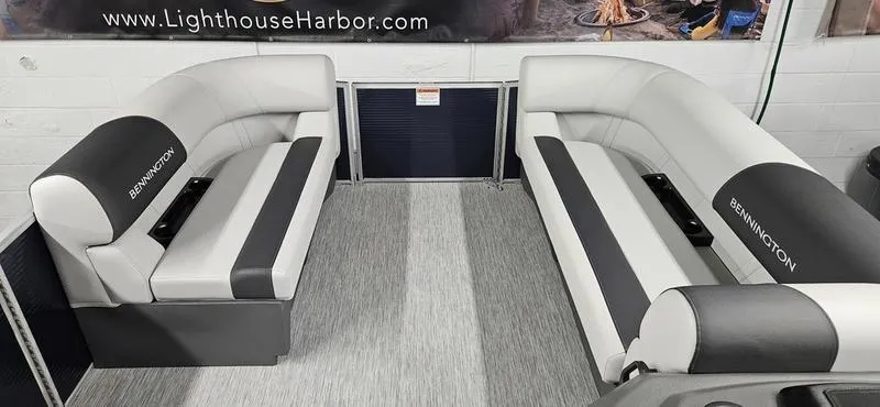Slide: The Image of Interior of 2026 Bennington 20 SL pontoon boat with gray and white seating. - 7