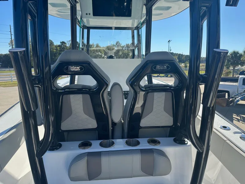 Slide: The Image of 2025 Cape Horn 28XS boat interior with two sleek, modern seats and cup holders. - 12