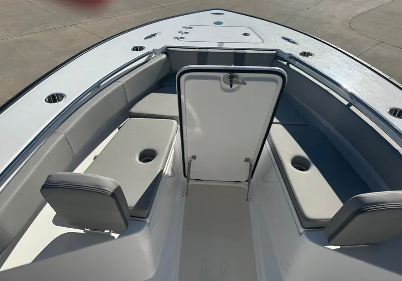 Slide: The Image of 2025 Cape Horn 28XS boat interior with seating and storage compartment. - 17