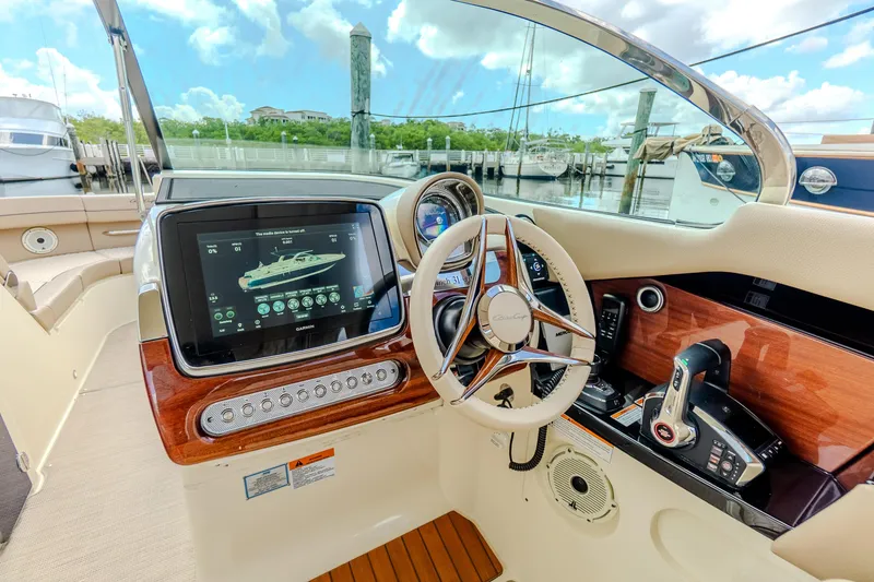 Slide: The Image of 2023 Chris-Craft Launch 31 GT dashboard with modern controls and navigation display. - 18