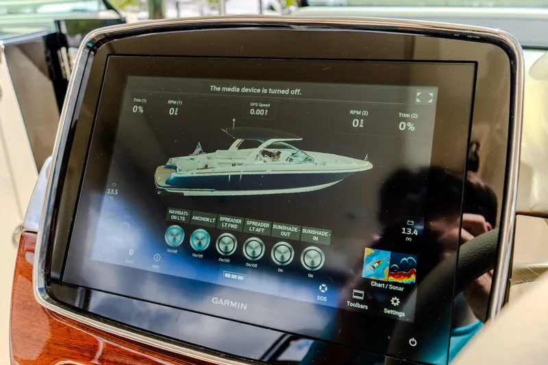Slide: The Image of 2023 Chris-Craft Launch 31 GT dashboard with Garmin display showing boat controls. - 21