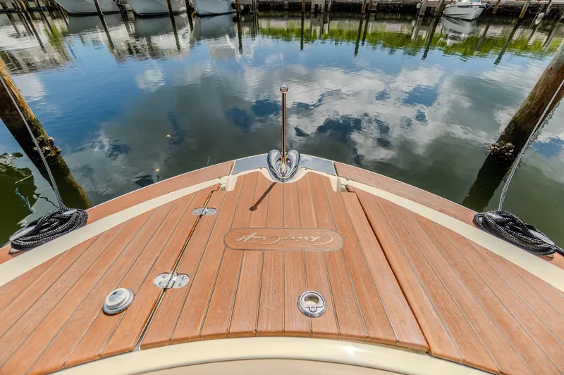 Slide: The Image of 2023 Chris-Craft Launch 31 GT boat deck with water reflection. - 28