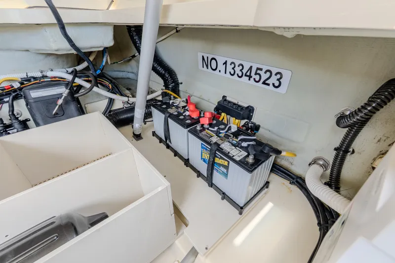 Slide: The Image of Battery compartment of 2023 Chris-Craft Launch 31 GT boat, showing wiring and components. - 32