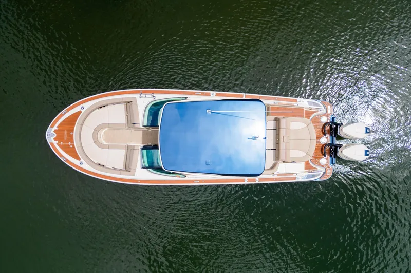 Slide: The Image of 2023 Chris-Craft Launch 31 GT boat, aerial view, on calm water. - 33