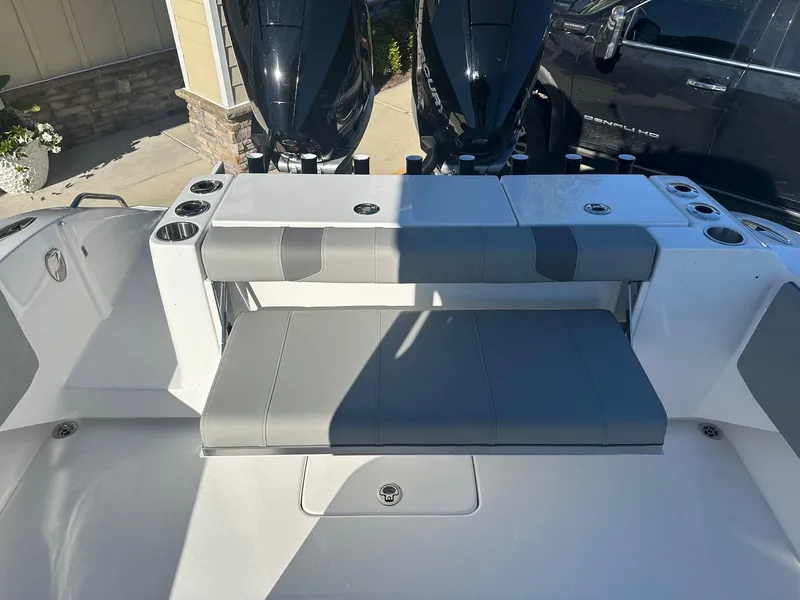 Slide: The Image of 2025 Cape Horn 28XS boat interior with seating and dual outboard motors. - 7