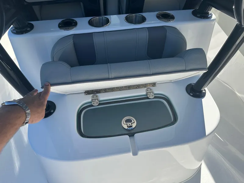Slide: The Image of 2025 Cape Horn 28XS boat seat with storage compartment and cup holders. - 11