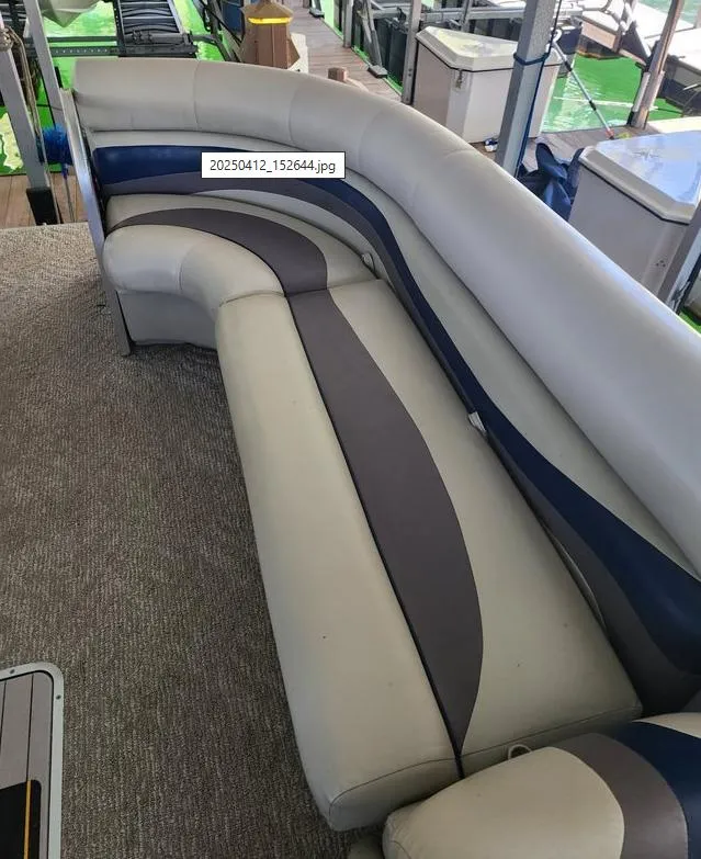 Slide: The Image of 2013 South Bay 522CR TT pontoon boat interior with curved seating and carpeted floor. - 10