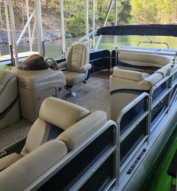 Slide: The Image of 2013 South Bay 522CR TT pontoon boat with beige seating, docked on a serene lake. - 15