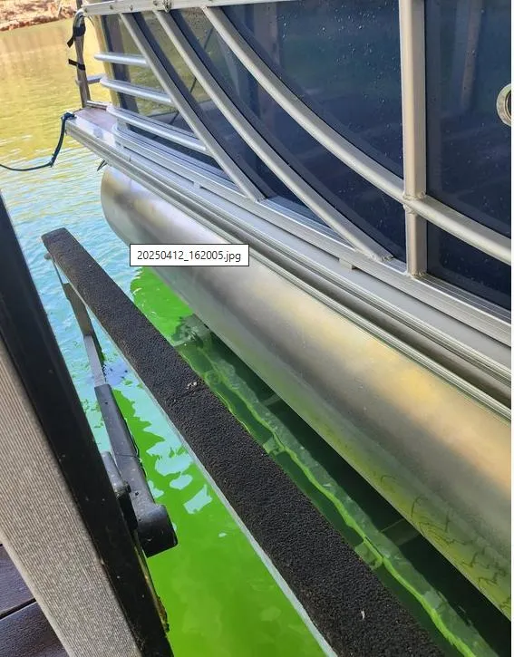 Slide: The Image of 2013 South Bay 522CR TT pontoon boat docked on green water. - 16