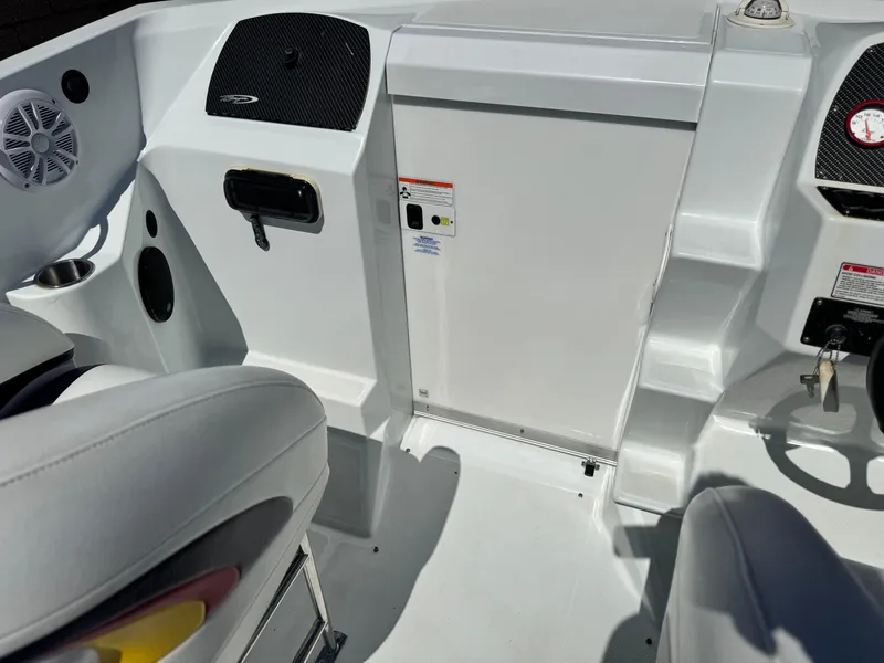 Slide: The Image of 2007 Baja 26 Outlaw boat interior with seating and control panel. - 19