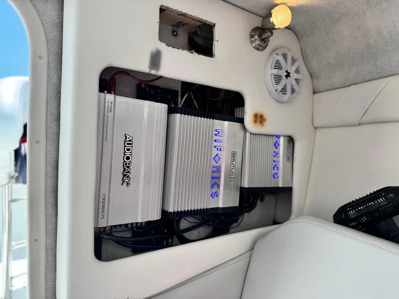 Slide: The Image of Audio system in a 2007 Baja 26 Outlaw boat with amplifiers and speaker. - 24