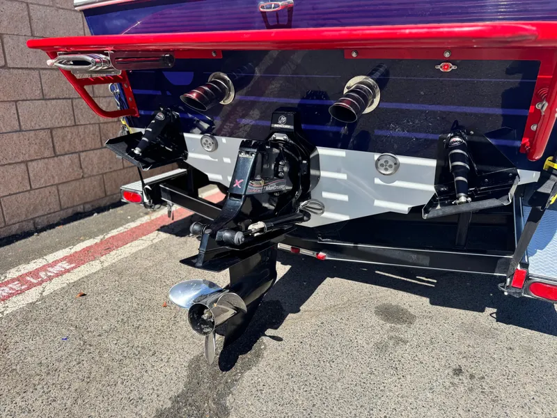 Slide: The Image of Rear view of a 2007 Baja 26 Outlaw boat with visible propeller and exhaust. - 7