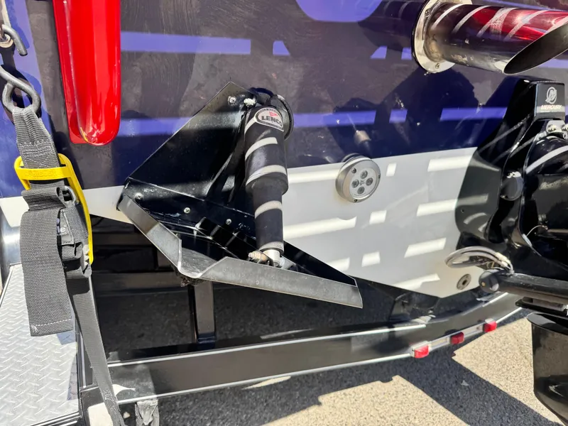 Slide: The Image of Rear view of a 2007 Baja 26 Outlaw boat, featuring trim tab and exhaust. - 8