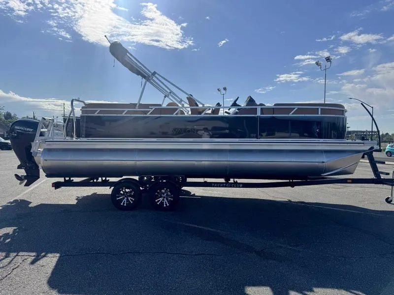 Slide: The Image of 2025 Avalon 2385 25 Venture QL pontoon boat on trailer under clear sky. - 9