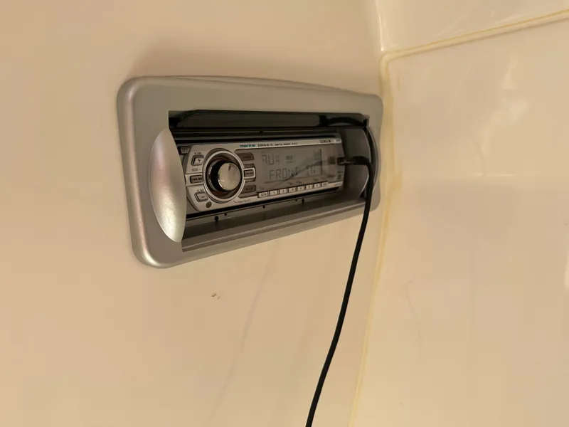 Slide: The Image of Marine stereo system in a 2014 Rinker Captiva 246 BR boat. - 21