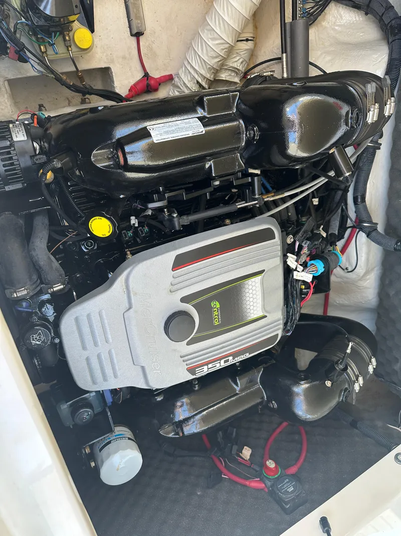 Slide: The Image of Engine of 2014 Rinker Captiva 246 BR boat, featuring MerCruiser 350 MAG. - 23