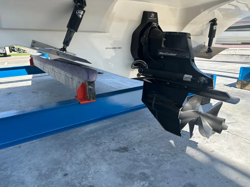 Slide: The Image of 2014 Rinker Captiva 246 BR boat with MerCruiser outdrive on a blue stand. - 6