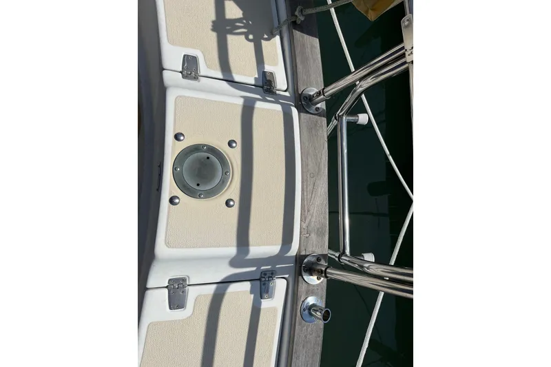 Slide: The Image of Deck of 1988 Tartan 31 sailboat with stainless steel fittings and beige panels. - 30