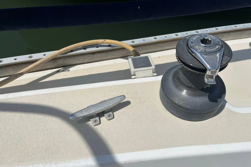 Slide: The Image of Deck of 1988 Tartan 31 sailboat with winch and cleat. - 31