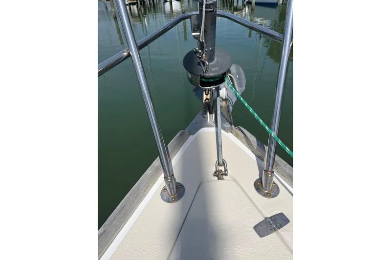 Slide: The Image of Bow of 1988 Tartan 31 sailboat with anchor chain and railing. - 38