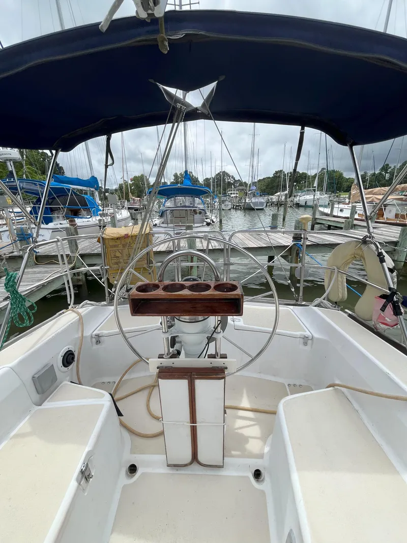 Slide: The Image of Cockpit view of 1988 Tartan 31 sailboat docked at marina. - 6