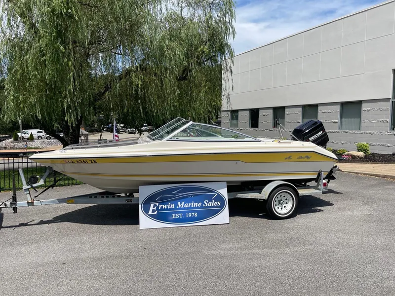 Slide: The Image of 1990 Sea Ray 180 Bow Rider boat on trailer at Erwin Marine Sales. - 1