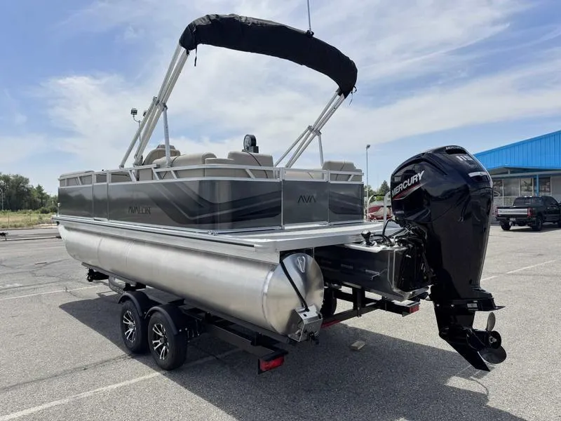 Slide: The Image of 2025 Avalon 2180 23 Venture QL pontoon boat with Mercury outboard motor on trailer. - 2