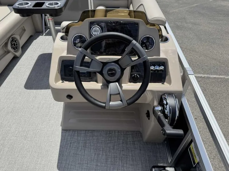Slide: The Image of Steering console of 2025 Avalon 2180 23 Venture QL boat with modern controls. - 4
