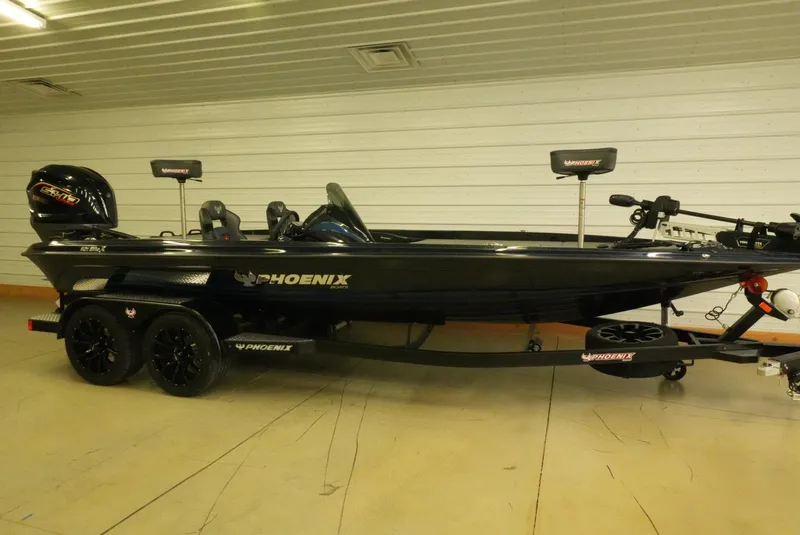 The Image of 2026 Phoenix 921 Elite X boat on trailer in indoor setting. - 1