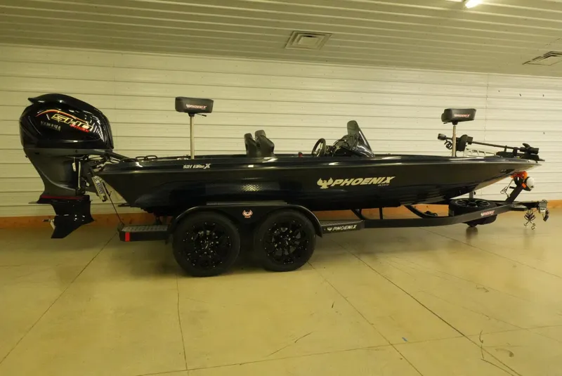 Slide: The Image of 2026 Phoenix 921 Elite X boat on trailer in indoor setting. - 3
