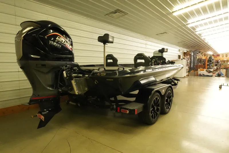 Slide: The Image of 2026 Phoenix 921 Elite X boat with Yamaha engine in a showroom. - 4