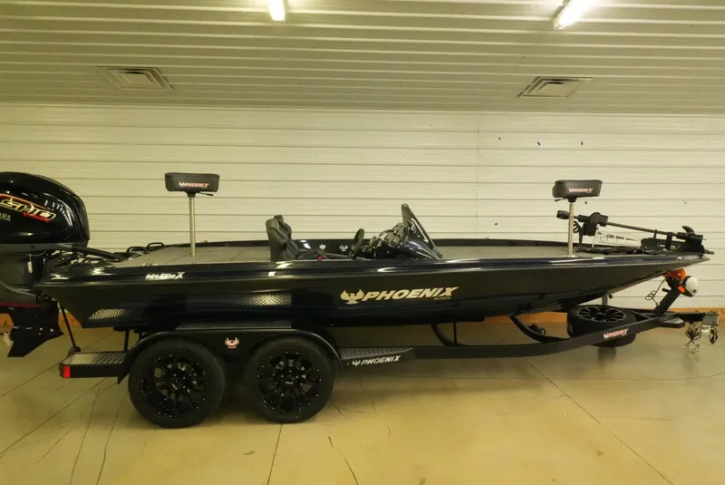 Slide: The Image of 2026 Phoenix 921 Elite X fishing boat in a showroom, side view. - 5